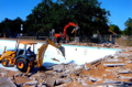 Backhoe in the pool